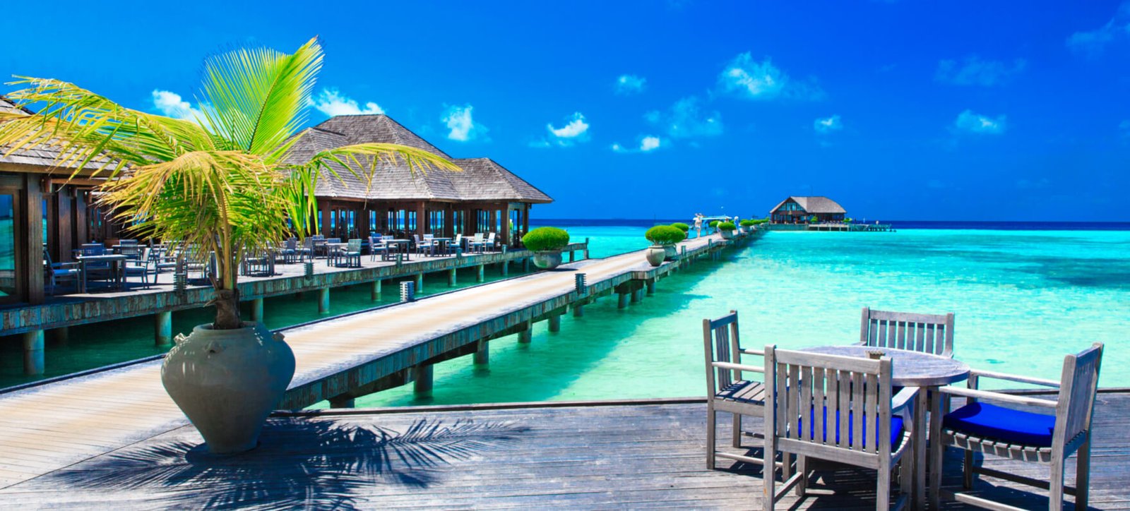 Overwater jetty and turquoise lagoon in the Maldives